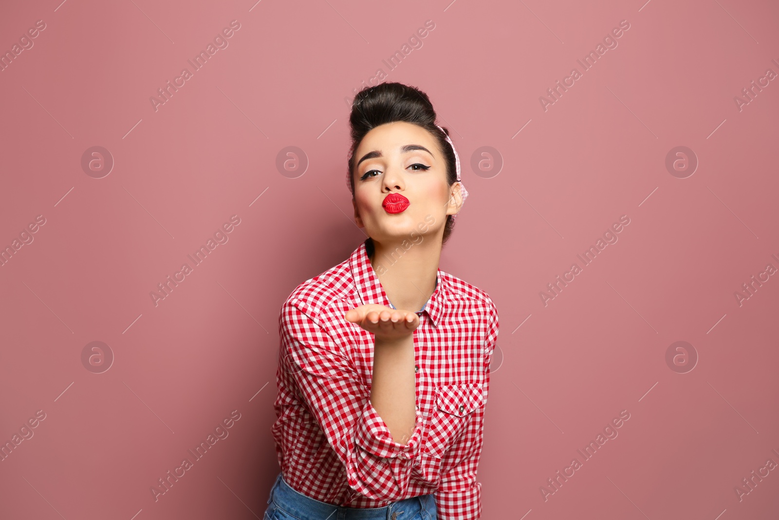 Photo of Portrait of funny young housewife on color background