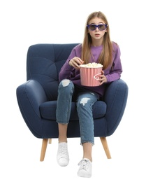 Photo of Emotional teenage girl with 3D glasses and popcorn sitting in armchair during cinema show on white background