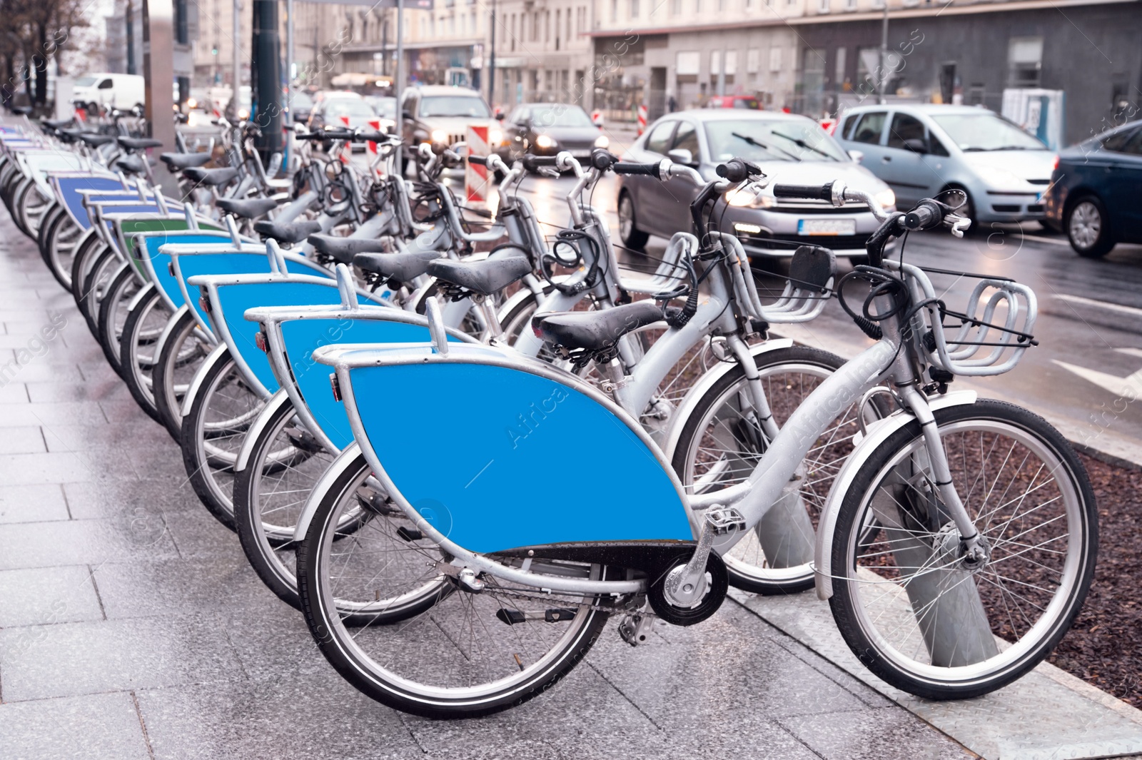 Photo of Many bicycles parked outdoors. Bike rental service