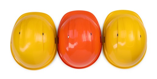 Photo of Hard hats isolated on white, top view. Safety equipment