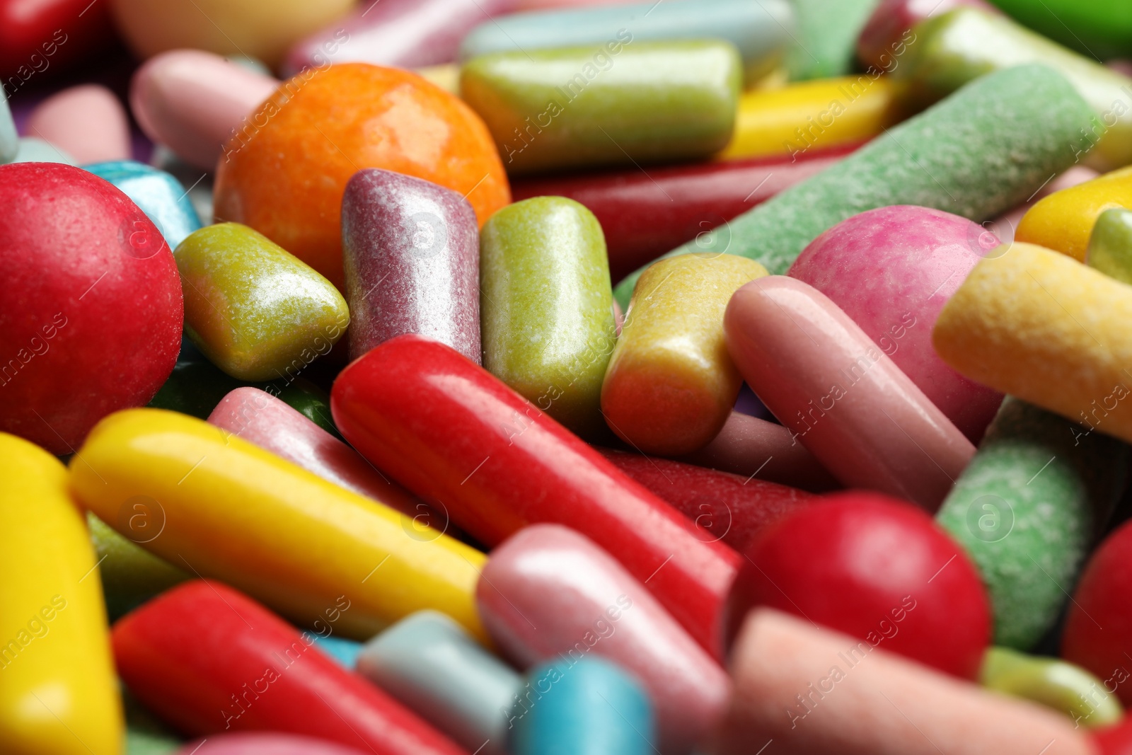 Photo of Many tasty bubble gums as background, closeup