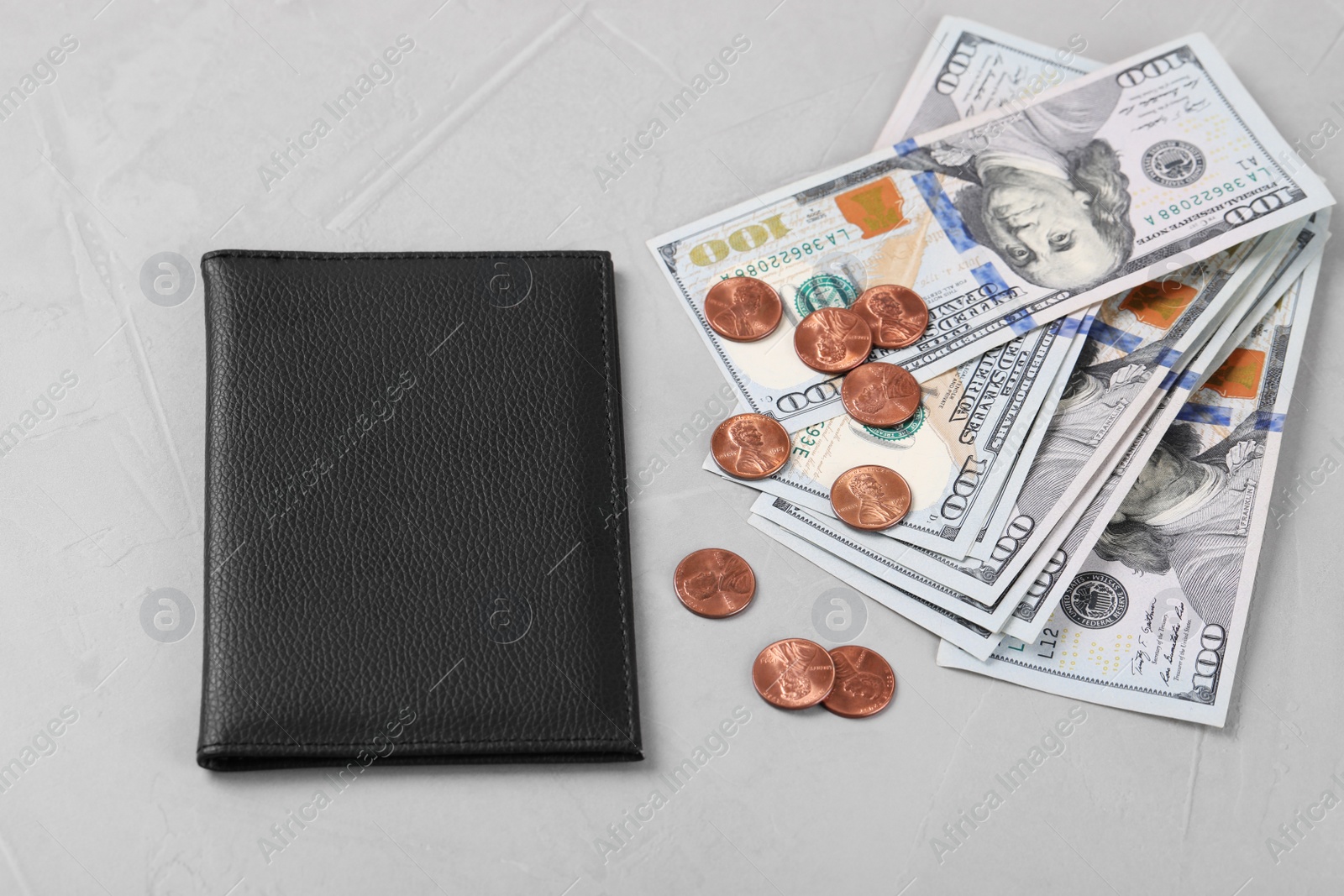 Photo of Pension certificate with American money on grey stone background