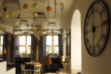 Photo of Blurred view of stylish modern cafe interior