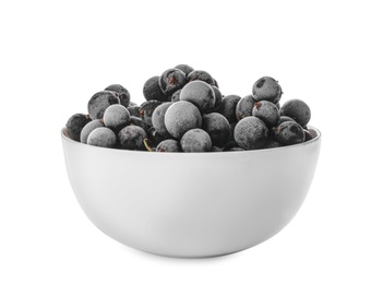 Tasty frozen black currants in bowl isolated on white