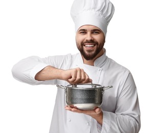 Happy young chef in uniform holding cooking pot on white background