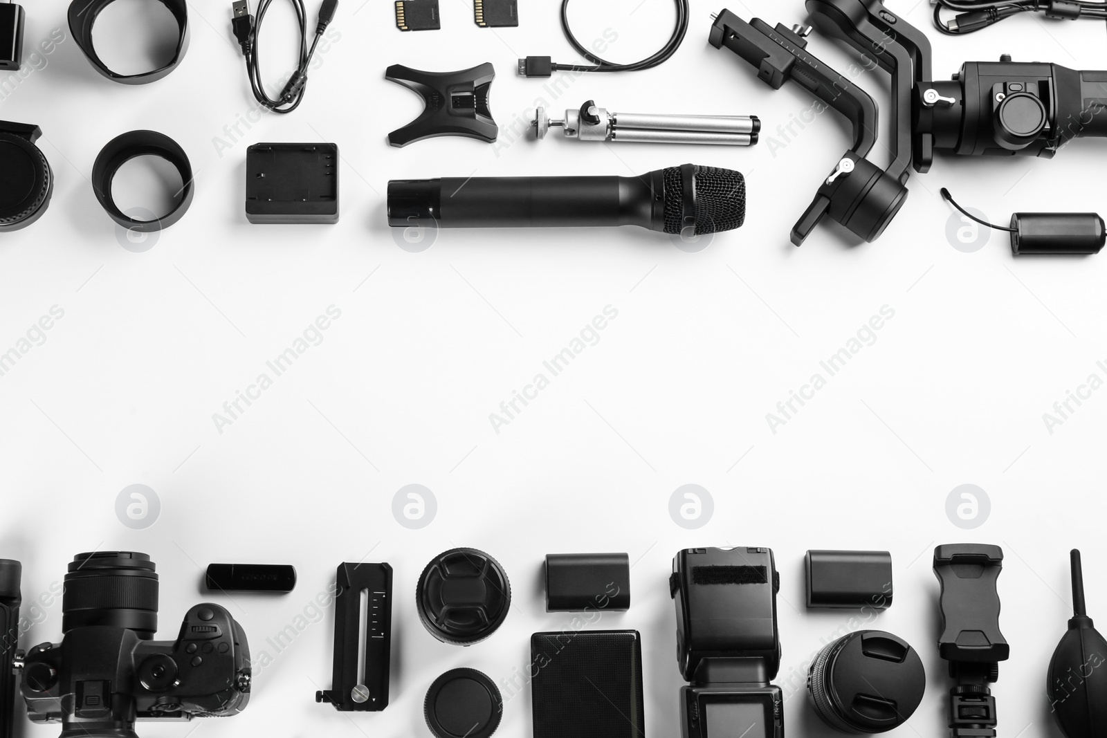 Photo of Composition with camera and video production equipment on white background, top view with space for text