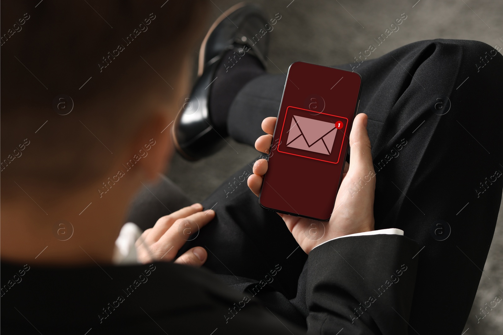 Image of New message notification. Man with mobile phone, closeup