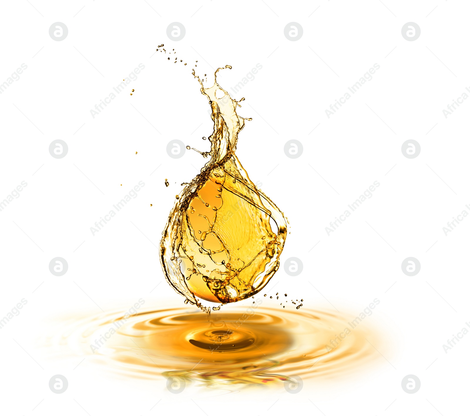 Image of Drop of cooking oil falling into oil on white background