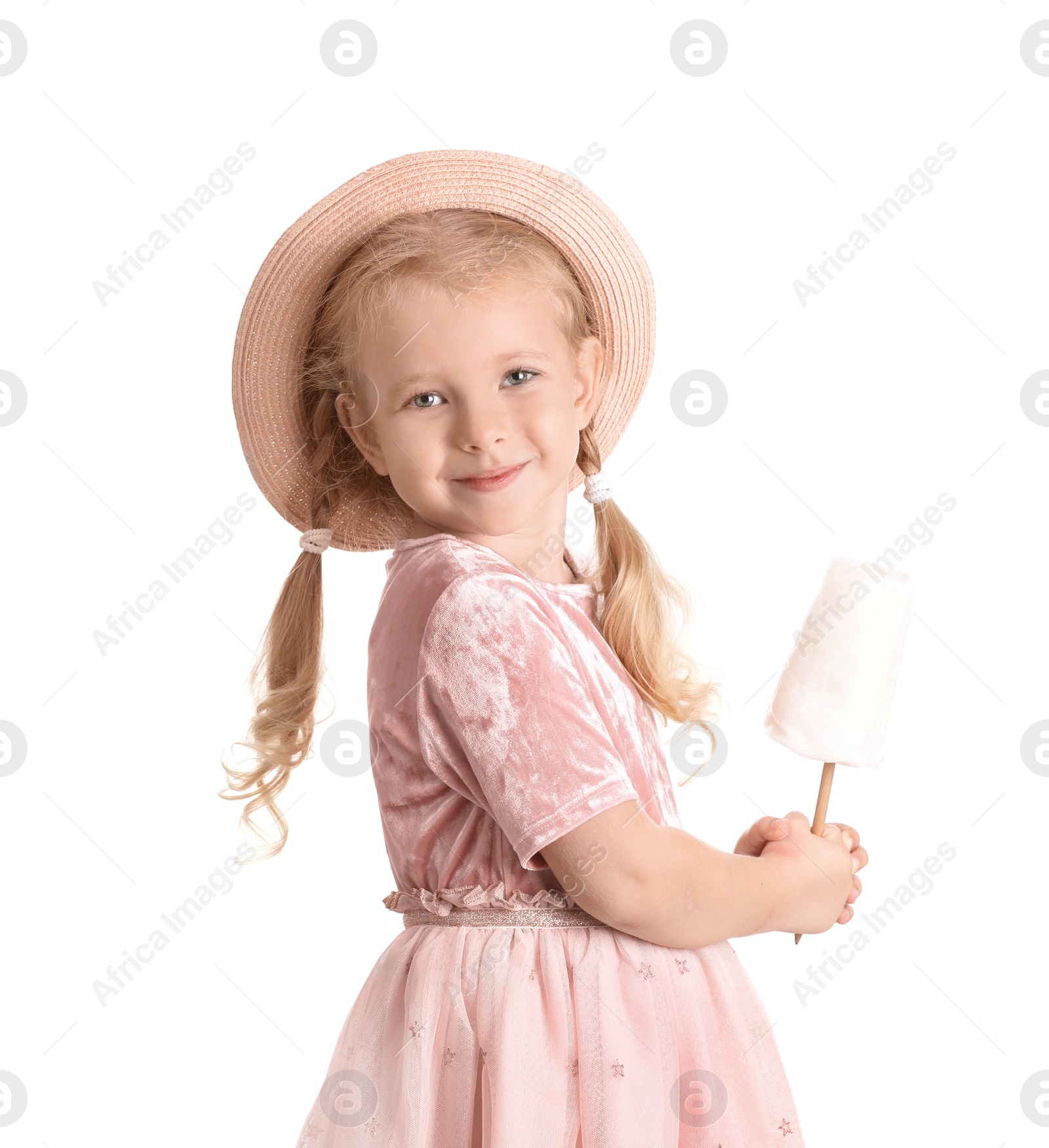 Photo of Cute little girl with cotton candy on white background