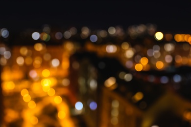 Photo of Blurred view of modern city at night. Bokeh effect