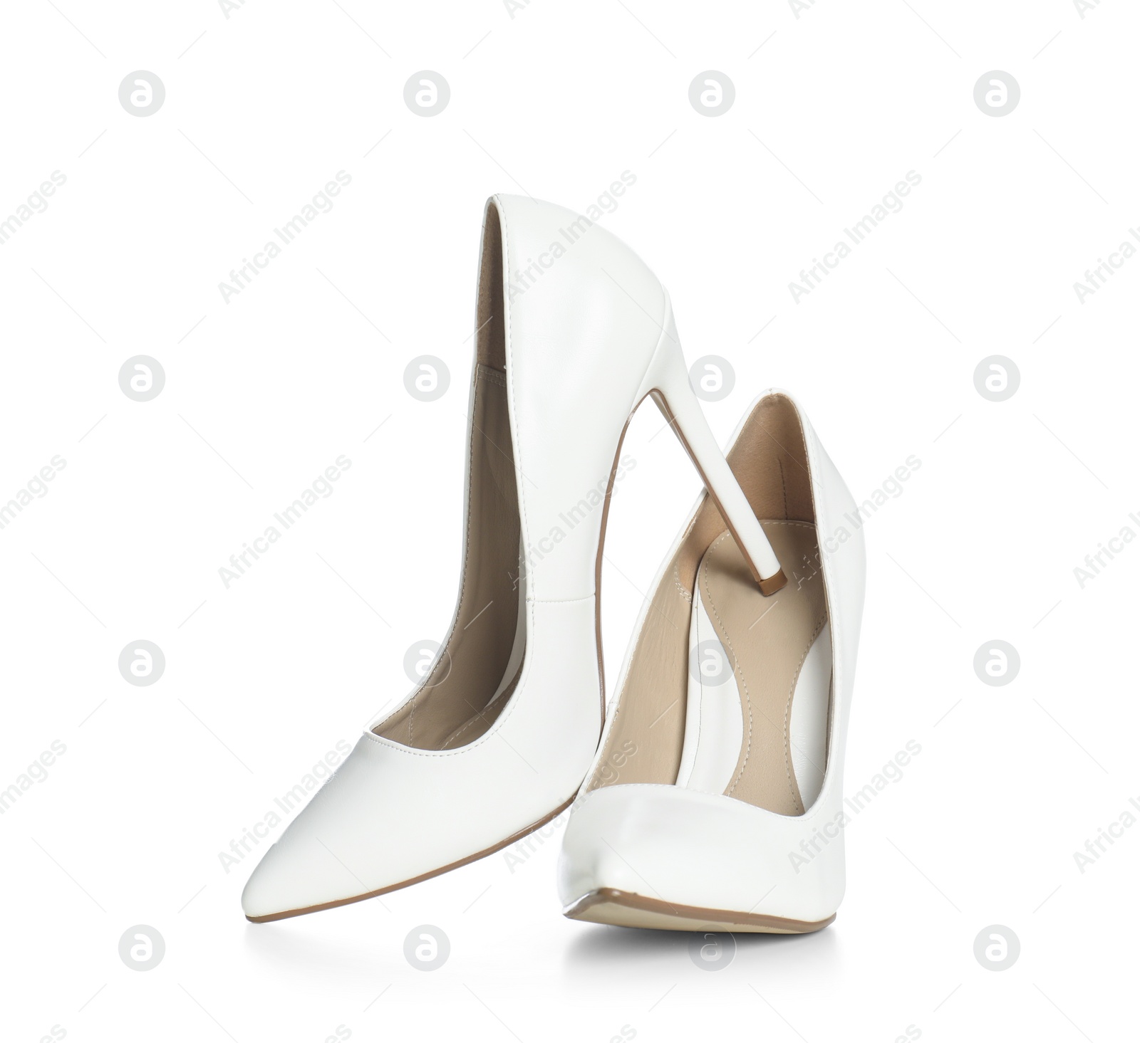 Photo of Beautiful classic wedding shoes on white background