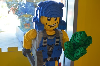 Photo of AMSTERDAM, NETHERLANDS - SEPTEMBER 10, 2022: Human figure made with colorful Lego constructor indoors