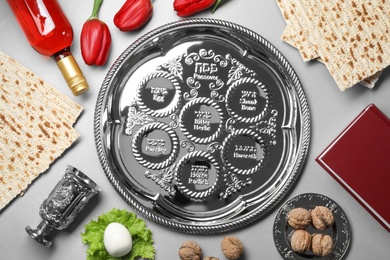 Photo of Flat lay composition with symbolic Passover (Pesach) items on color background