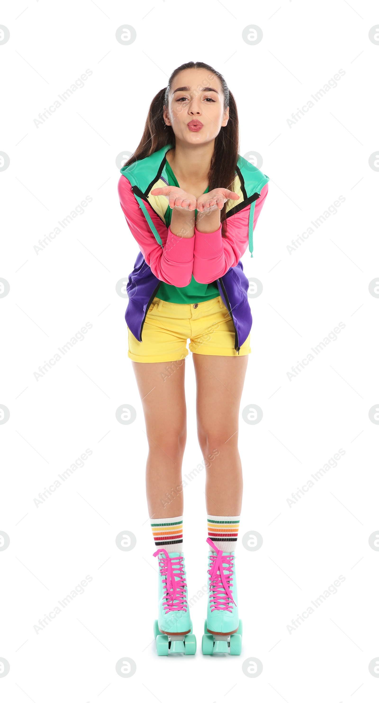 Photo of Full length portrait of young woman with roller skates on white background