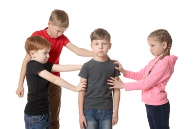 Kids bullying upset boy on white background