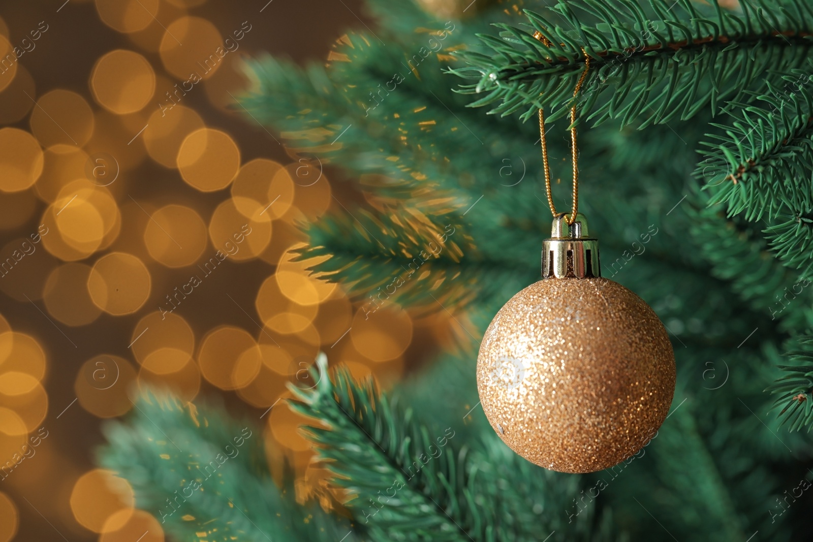 Photo of Beautiful Christmas tree with decor against blurred lights on background