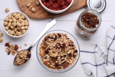 Photo of Flat lay composition with tasty granola on white wooden table