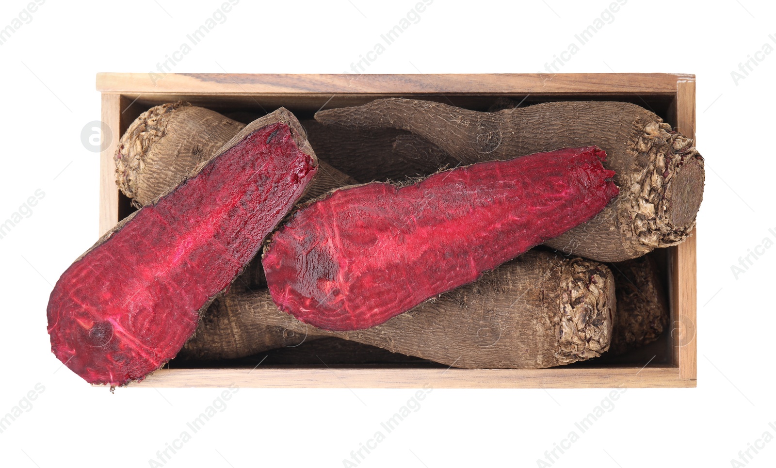 Photo of Whole and cut red beets in wooden crate isolated on white, top view