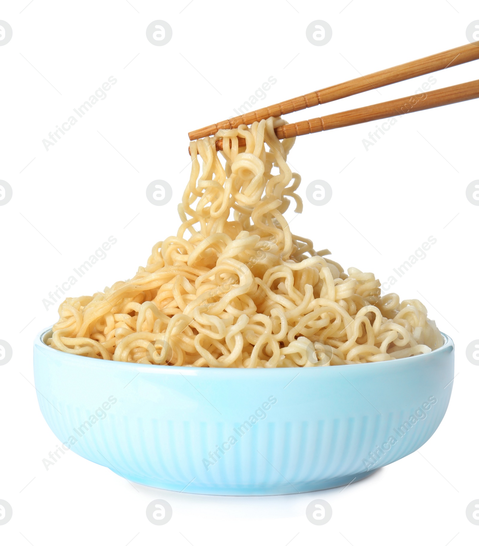 Photo of Chopsticks with tasty instant noodles over bowl isolated on white