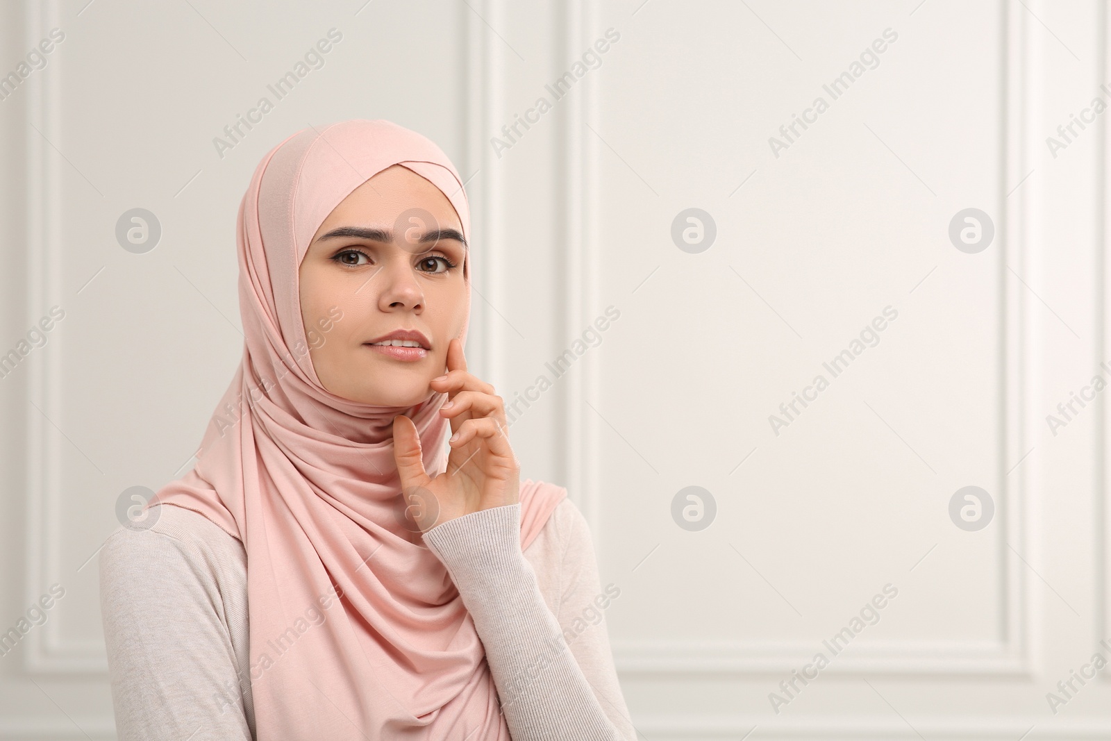 Photo of Portrait of Muslim woman in hijab indoors