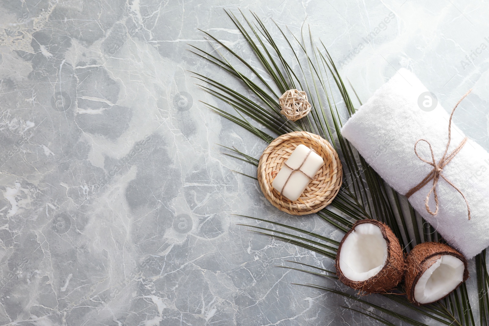 Photo of Flat lay composition with soap on grey marble background. Space for text