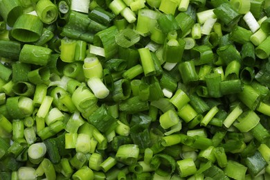 Photo of Fresh green onion as background, top view