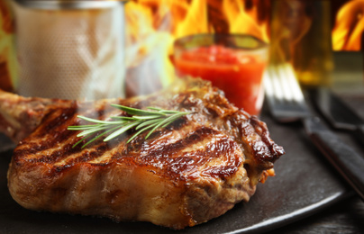 Tasty grilled beef steak on table, closeup