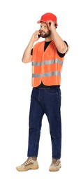 Man in reflective uniform talking on smartphone against white background