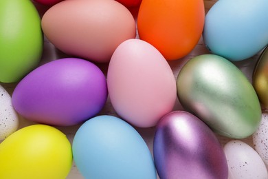 Beautifully painted Easter eggs as background, top view