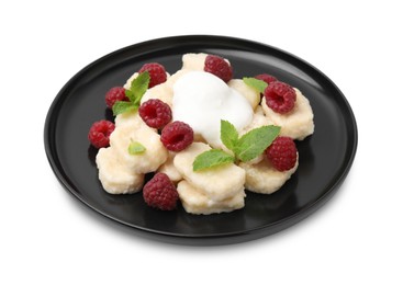 Plate of tasty lazy dumplings with raspberries, sour cream and mint leaves isolated on white