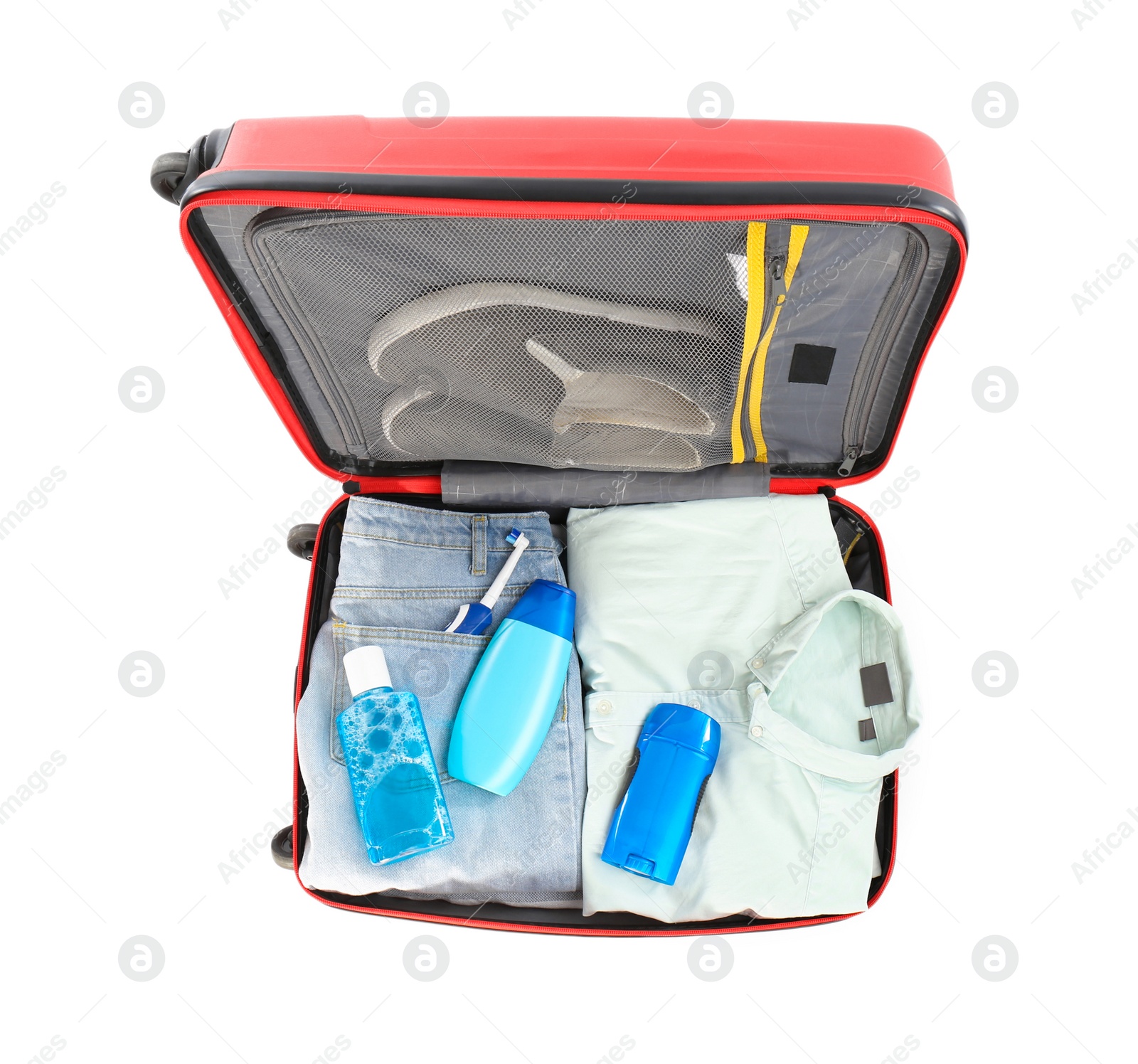 Photo of Packed suitcase with deodorant and clothes on white background, top view