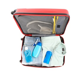 Photo of Packed suitcase with deodorant and clothes on white background, top view