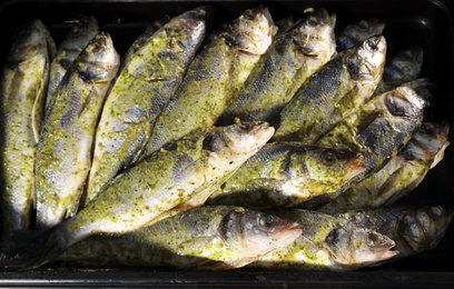 Photo of Fresh marinated fish in supermarket, top view