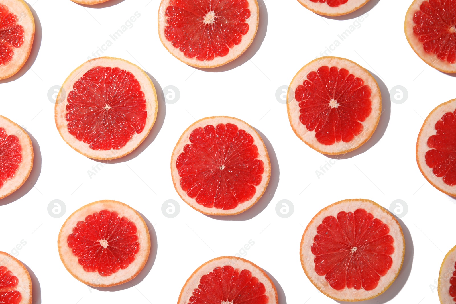 Photo of Fresh sliced ripe grapefruits on white background, top view