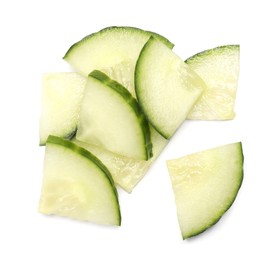 Photo of Pile of fresh cut cucumber isolated on white, top view
