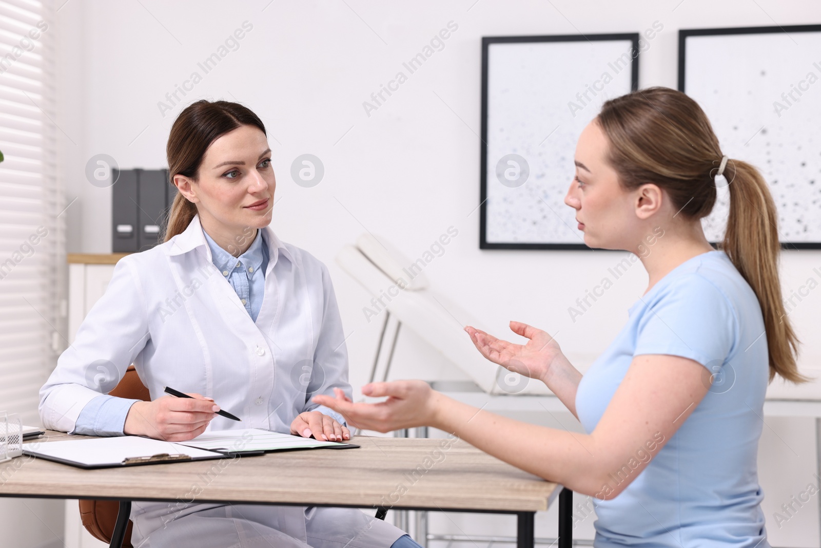 Photo of Mammologist's appointment. Doctor and woman in hospital