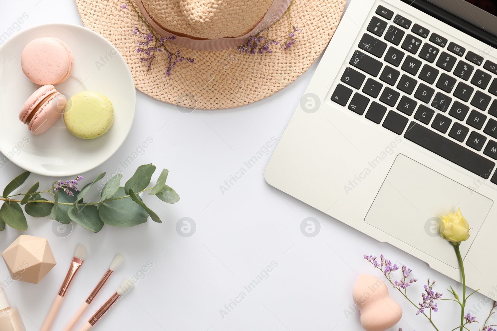 Photo of Composition with laptop on white background, top view. Fashion blogger