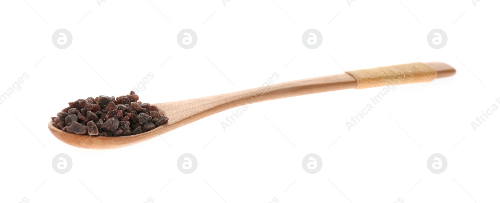 Photo of Black salt in wooden spoon isolated on white