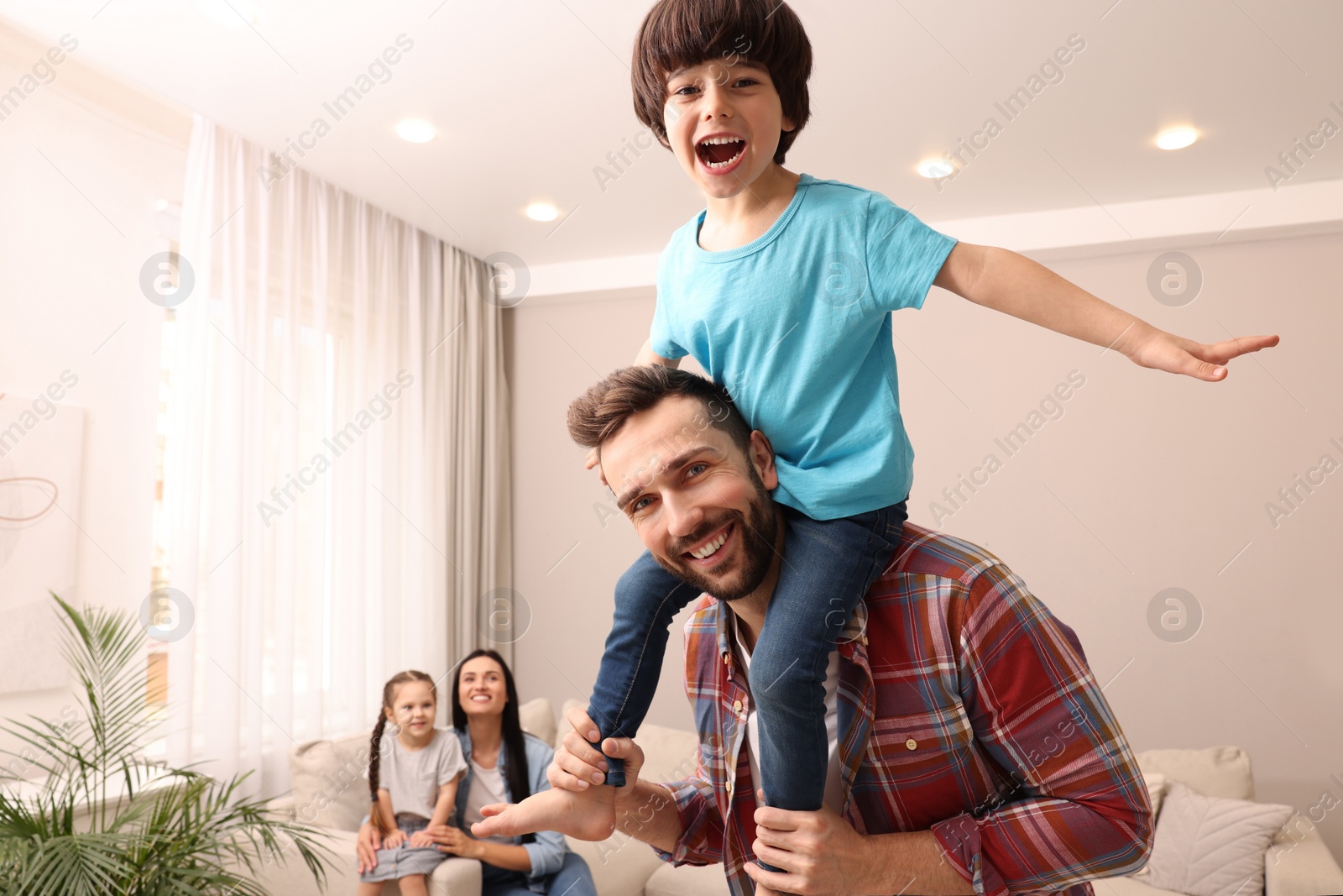 Photo of Happy family spending time together at home