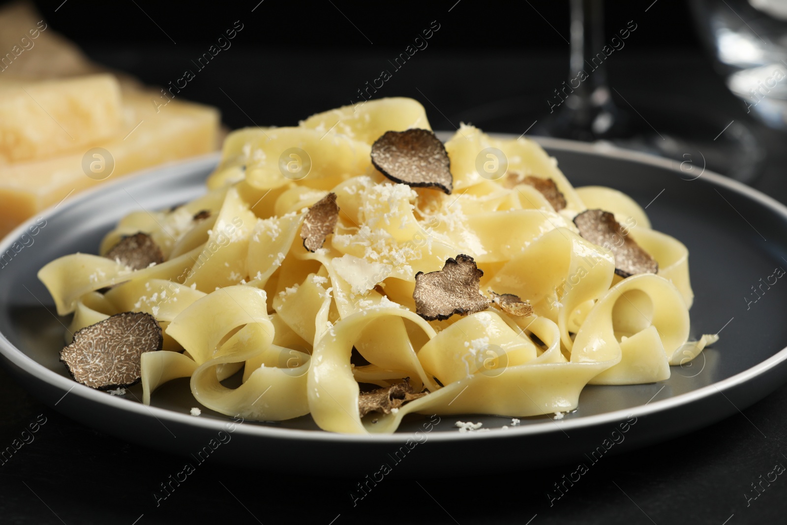 Photo of Tasty tagliatelle with truffle on table, closeup