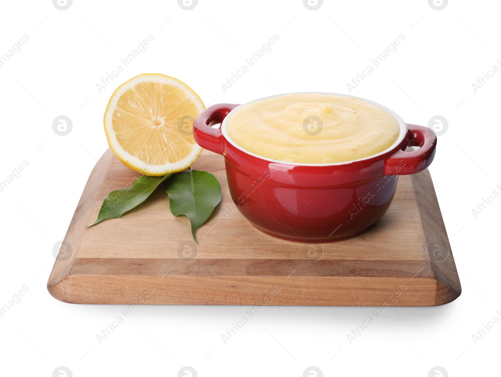 Photo of Delicious lemon curd in bowl, fresh citrus fruit and green leaves isolated on white