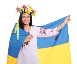 Photo of Young woman in national clothes with flag of Ukraine on white background