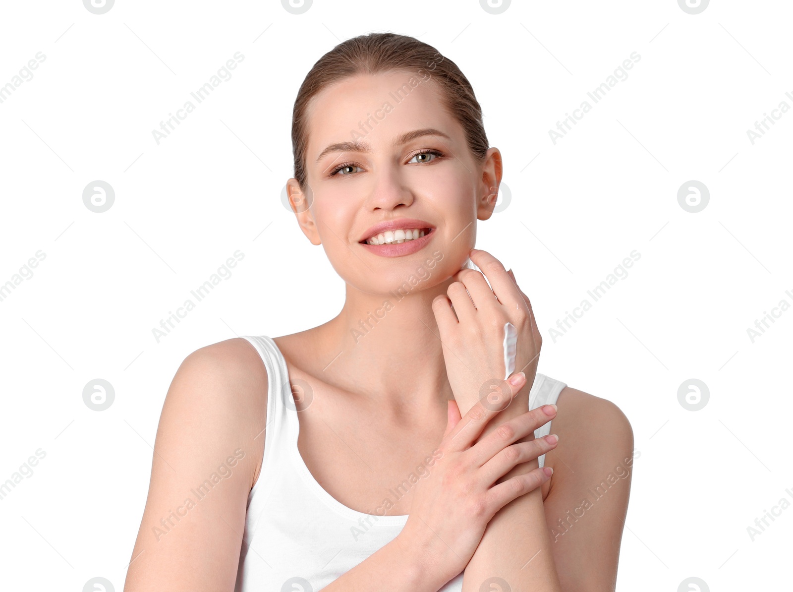 Photo of Young woman applying hand cream on white background