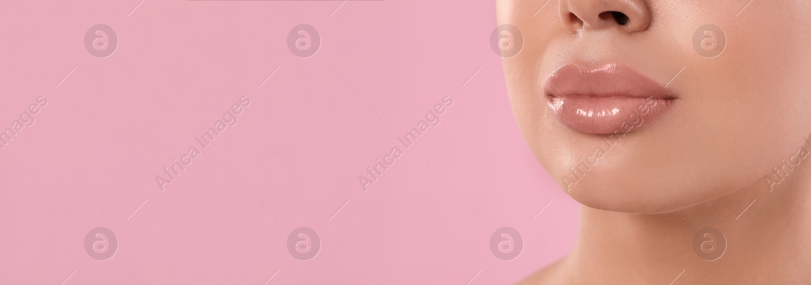 Image of Woman with beautiful lips on pink background, closeup view with space for text. Banner design