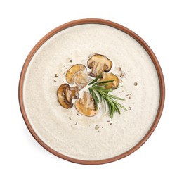 Fresh homemade mushroom soup in ceramic bowl isolated on white, top view