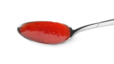 Photo of Spicy chili sauce in spoon isolated on white