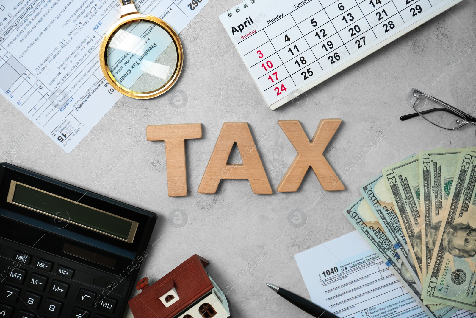 Photo of Flat lay composition with word TAX and money on grey background