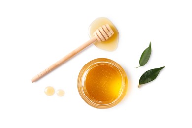 Photo of Tasty honey in glass jar, leaves and dipper on white background, flat lay. Space for text