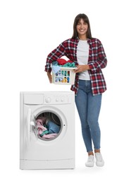 Photo of Beautiful woman with laundry basket near washing machine on white background