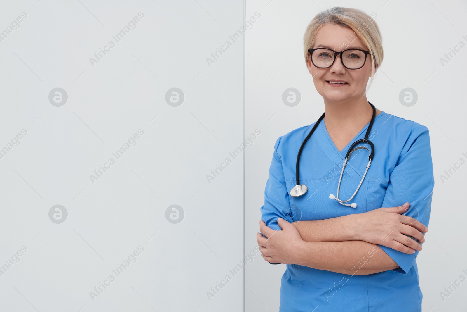 Photo of Professional doctor near flipchart, space for text